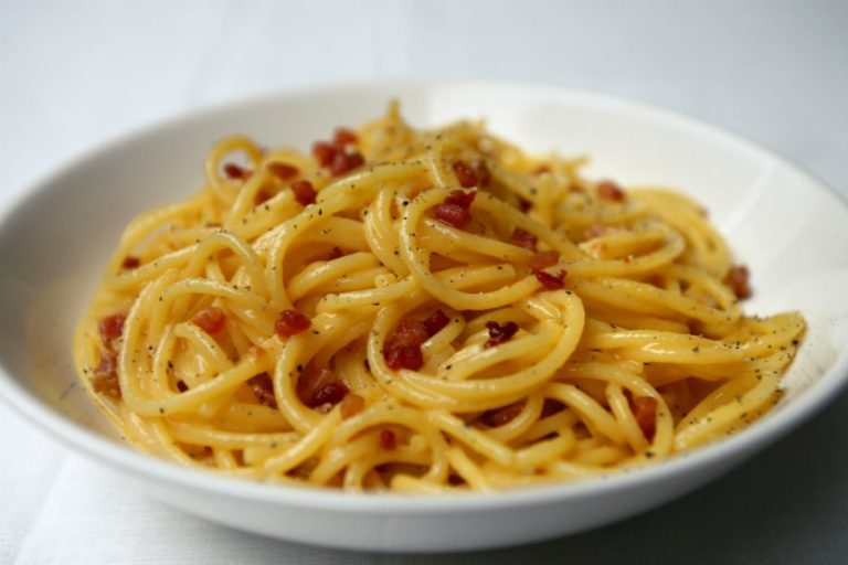 Spaghetti carbonara with crispy guanciale and cracked black pepper